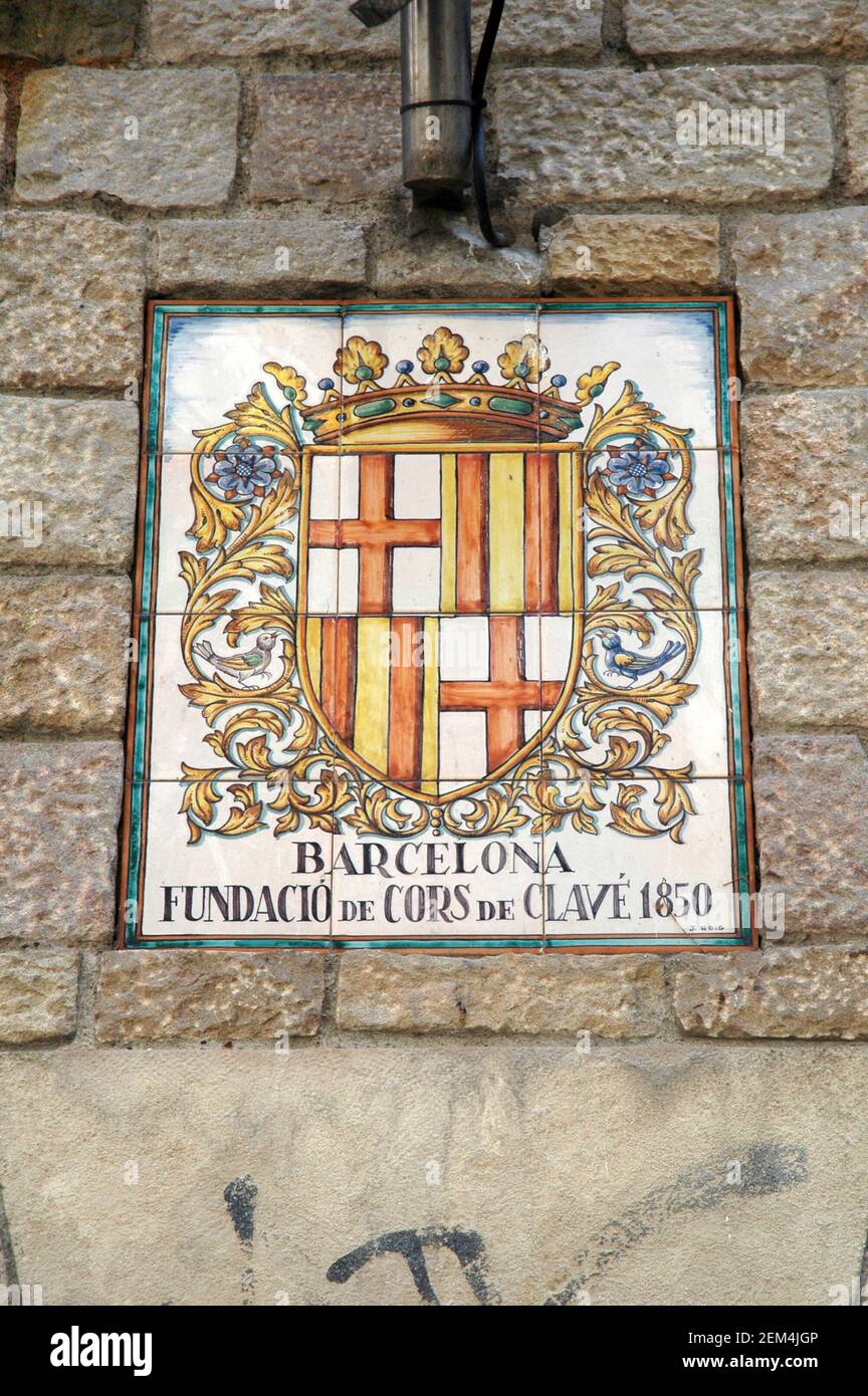 Coat of arms of the city of Barcelona, painted in traditional spanish tiles. The four red stripes are the emblem of Catalonia Stock Photo