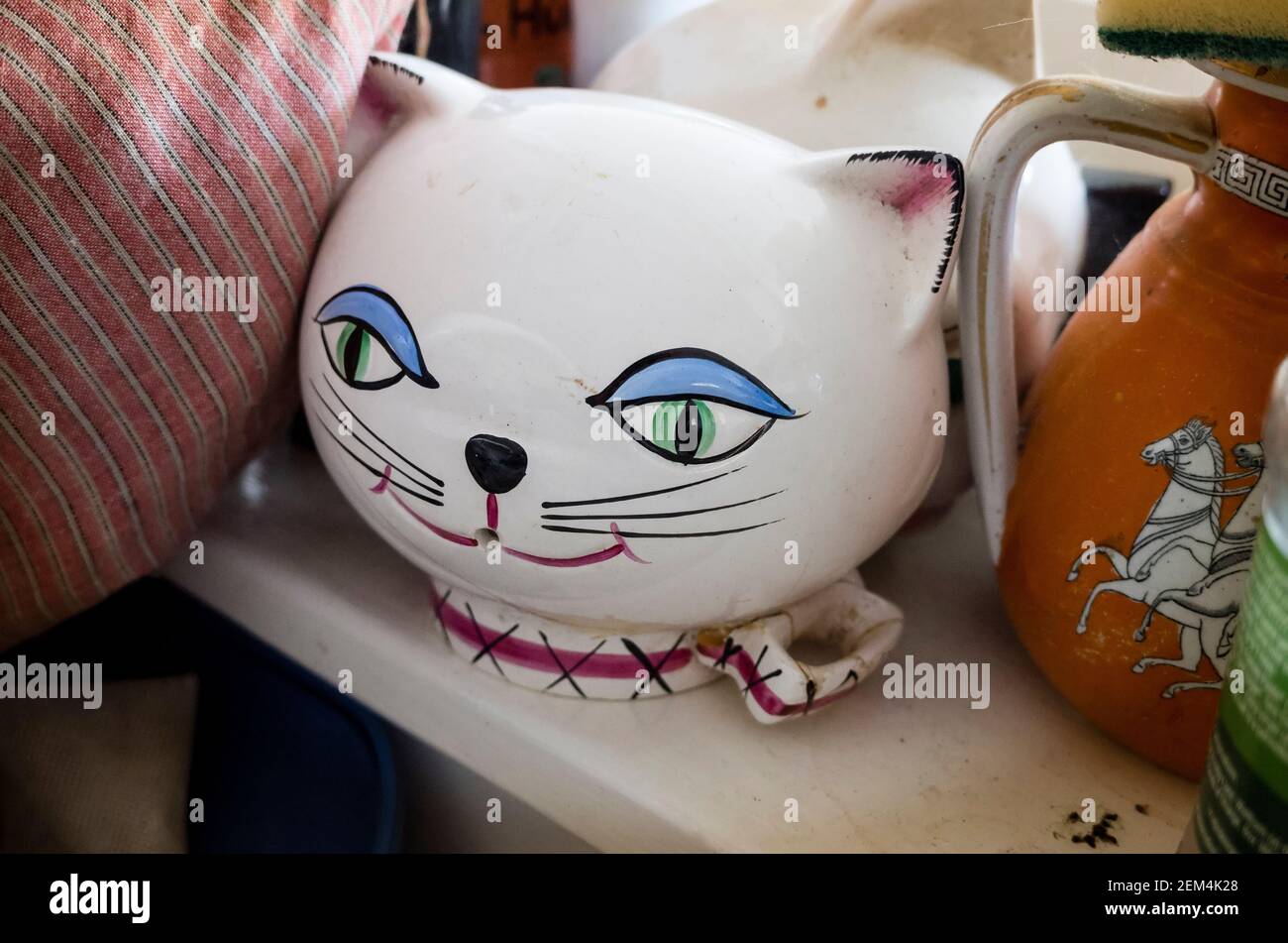 A cute string container in the form of a white ceramic cat's head in an English home Stock Photo