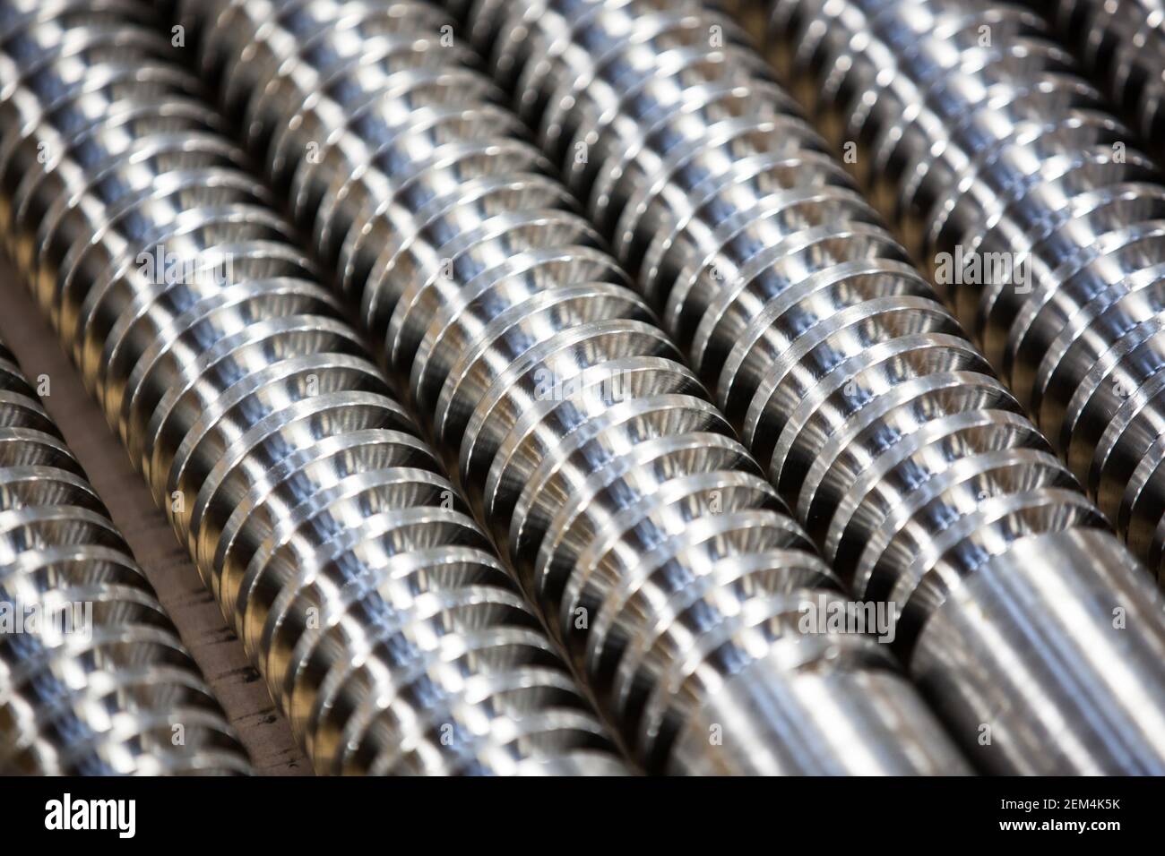 Screw threads on clean and new silver steel rods Stock Photo