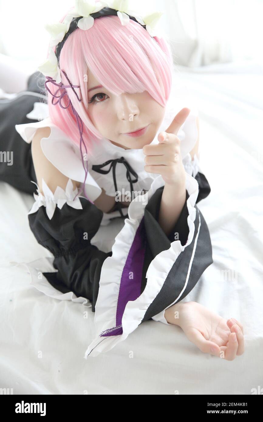 Portrait of Japan anime cosplay woman , white japanese maid in white tone  room Stock Photo - Alamy