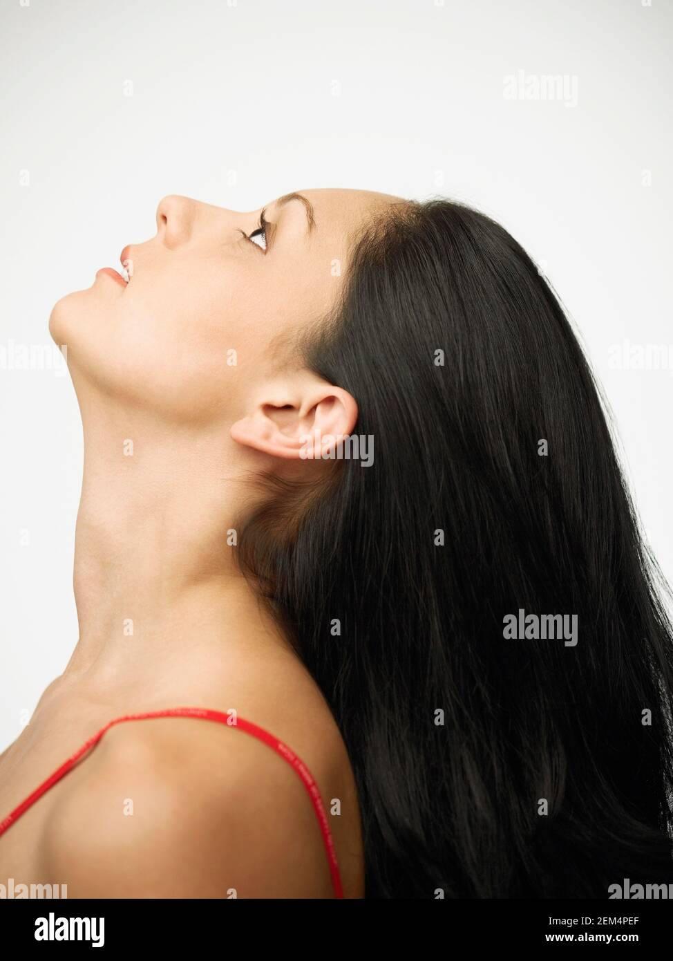 Side profile of a young woman looking up Stock Photo
