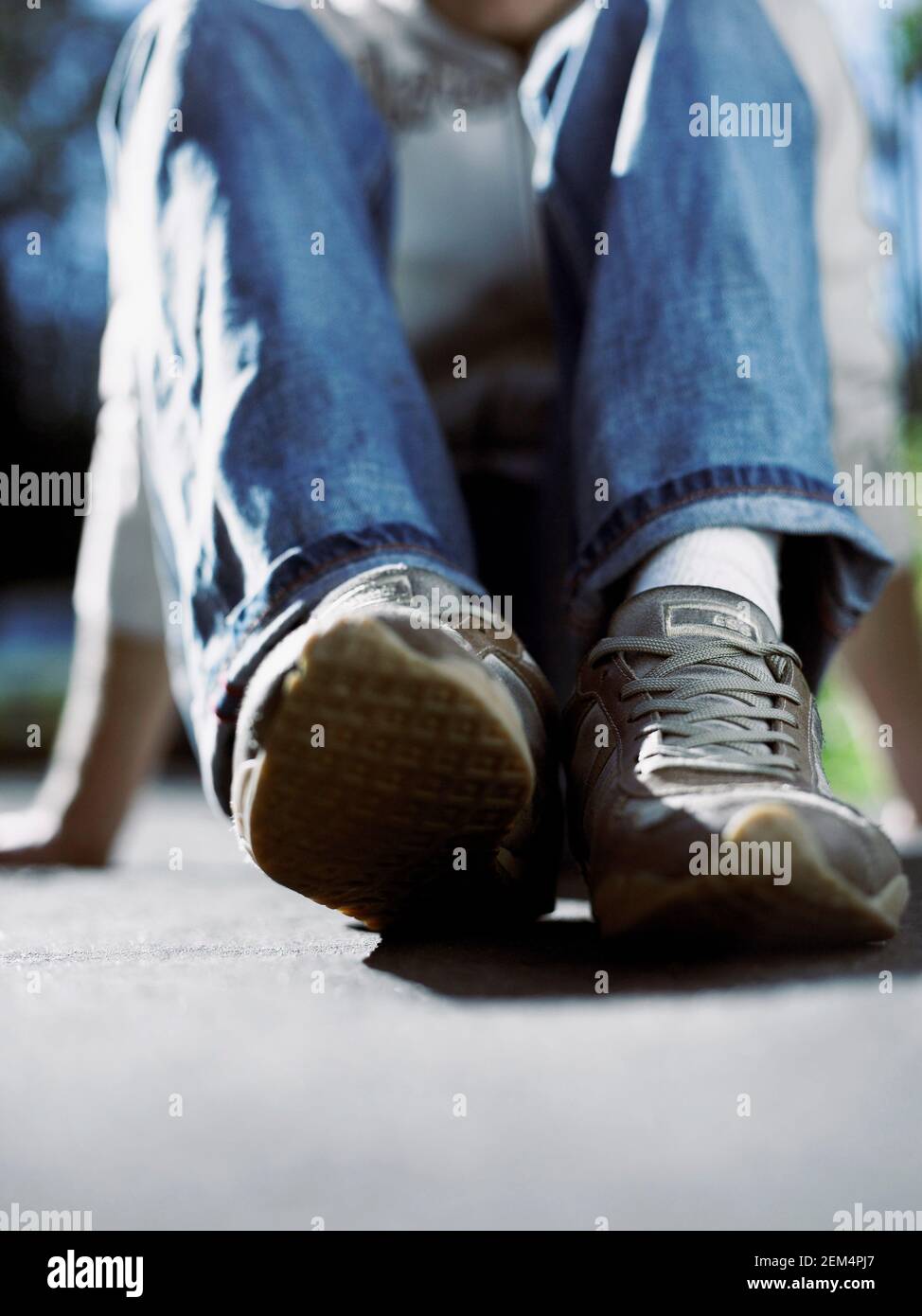 Low section view of a person wearing sports shoes Stock Photo