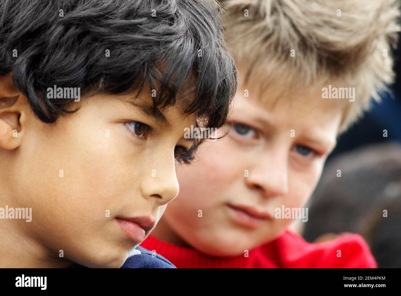 Close-up of two boys looking serious Stock Photo