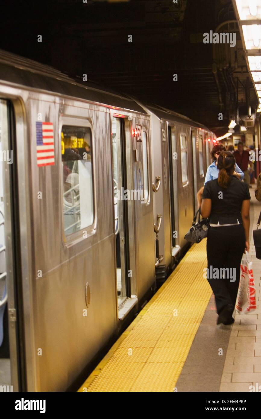 Passengers at a subway platform Stock Photo
