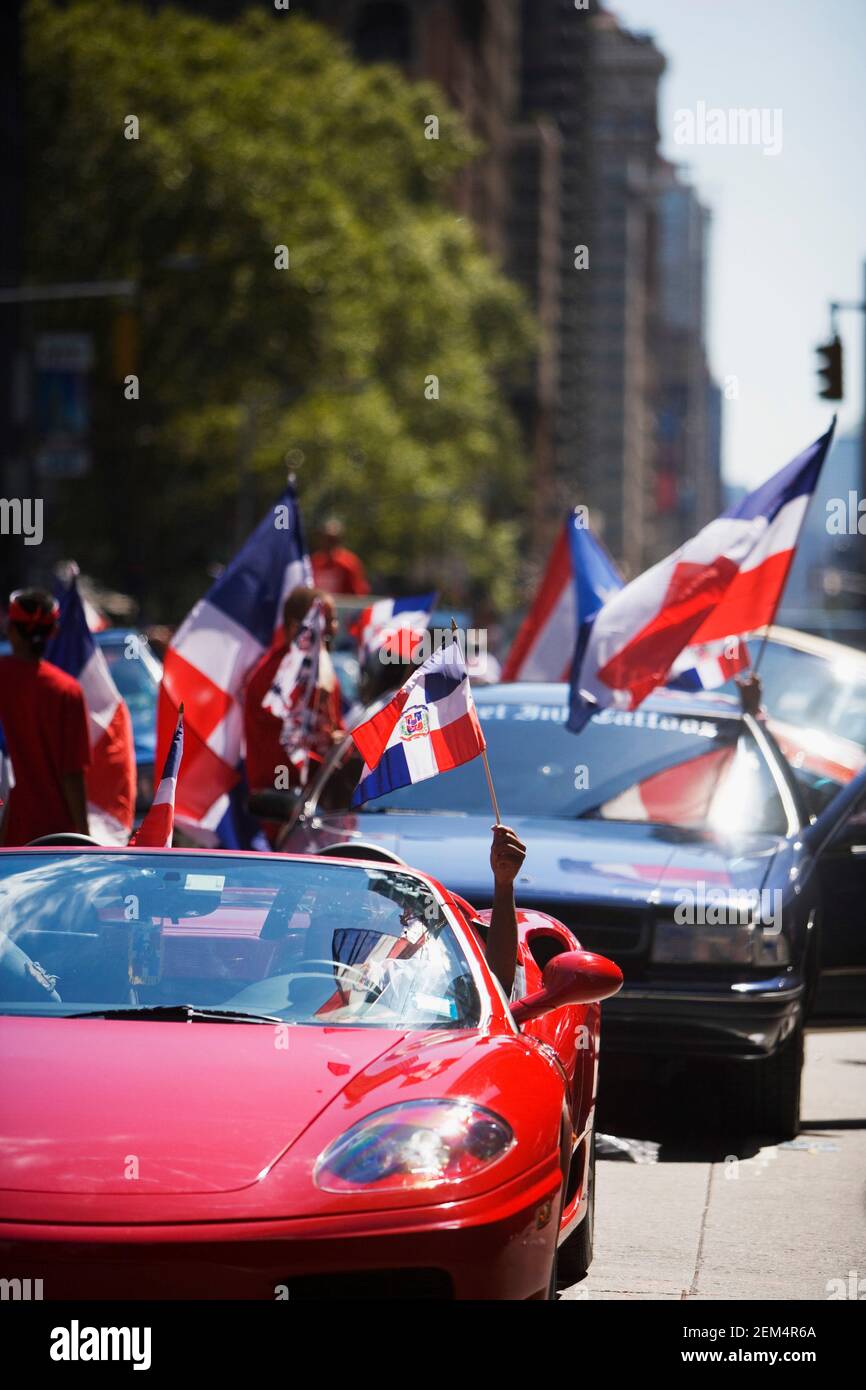 Group of people holding the Dominican Republic flags in cars Stock Photo