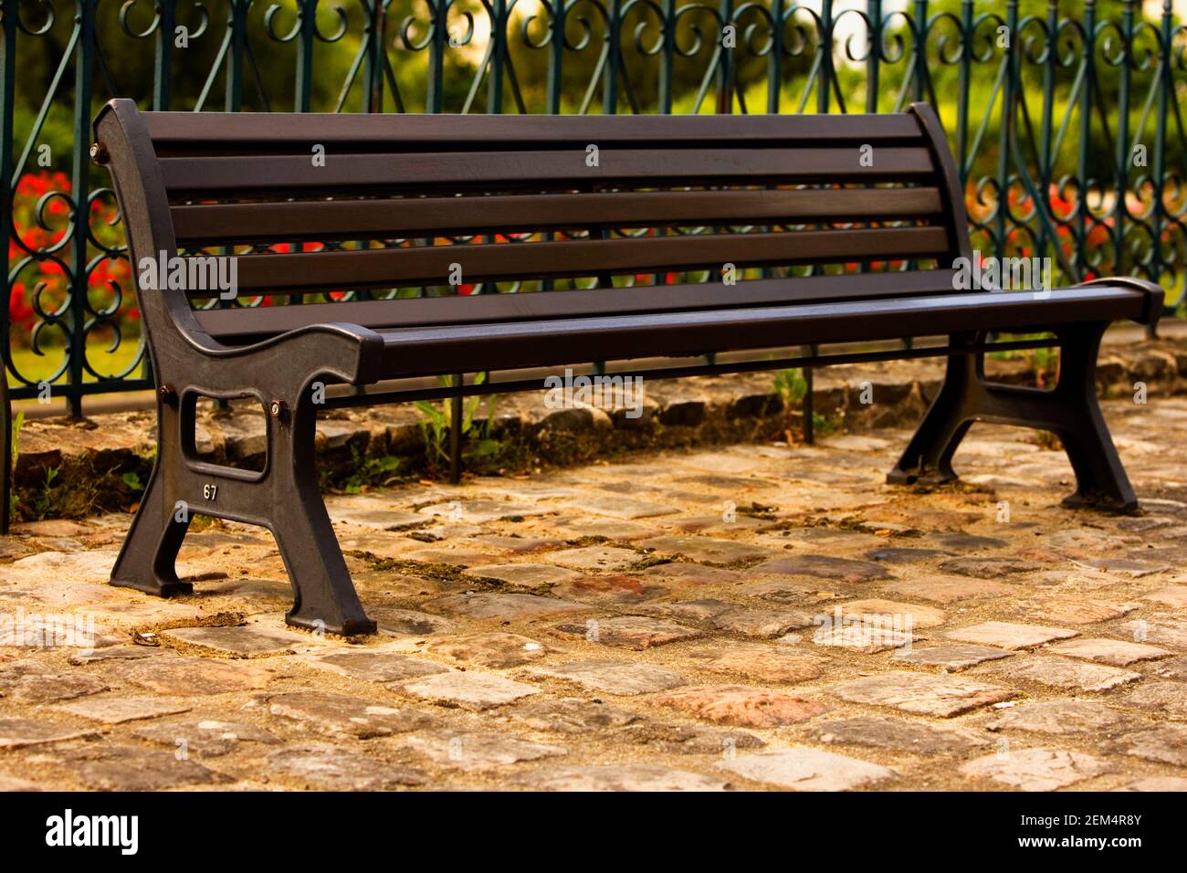 Close-up of an empty bench in a garden Stock Photo