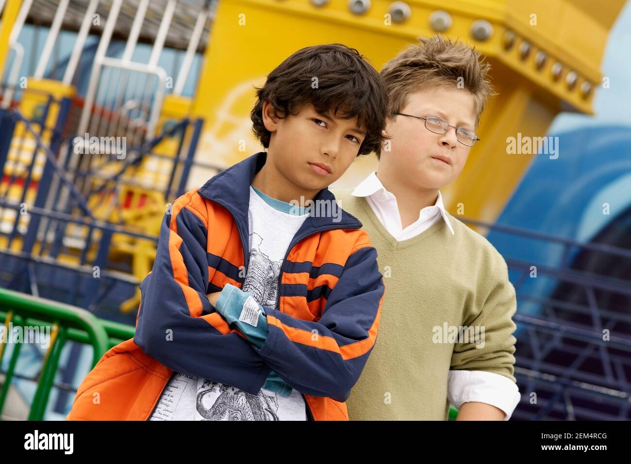 Close-up of two boys standing in an amusement park Stock Photo