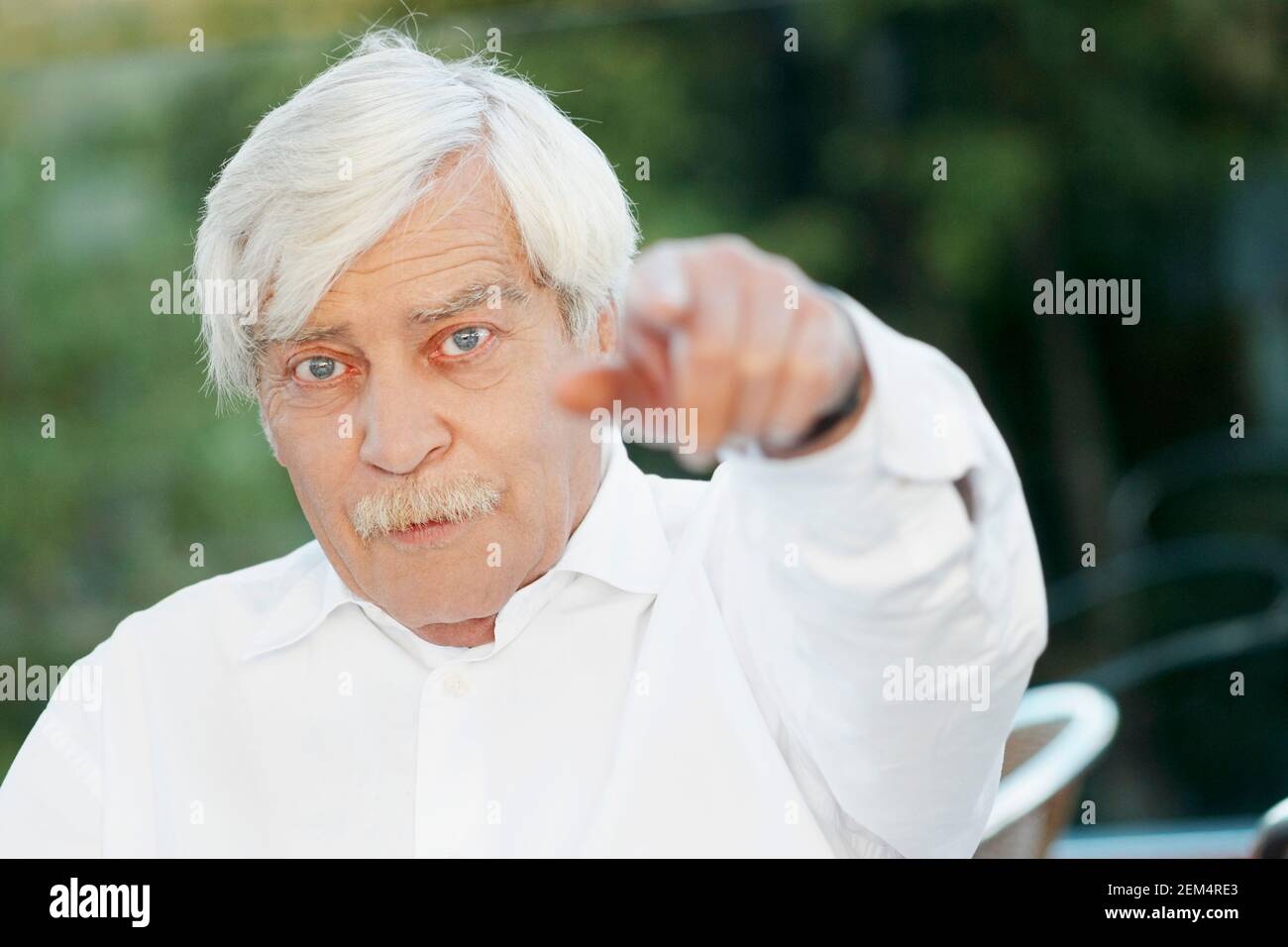 Portrait of a senior man pointing Stock Photo