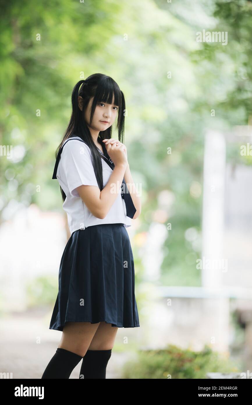 Portrait of asian japanese school girl costume looking at park