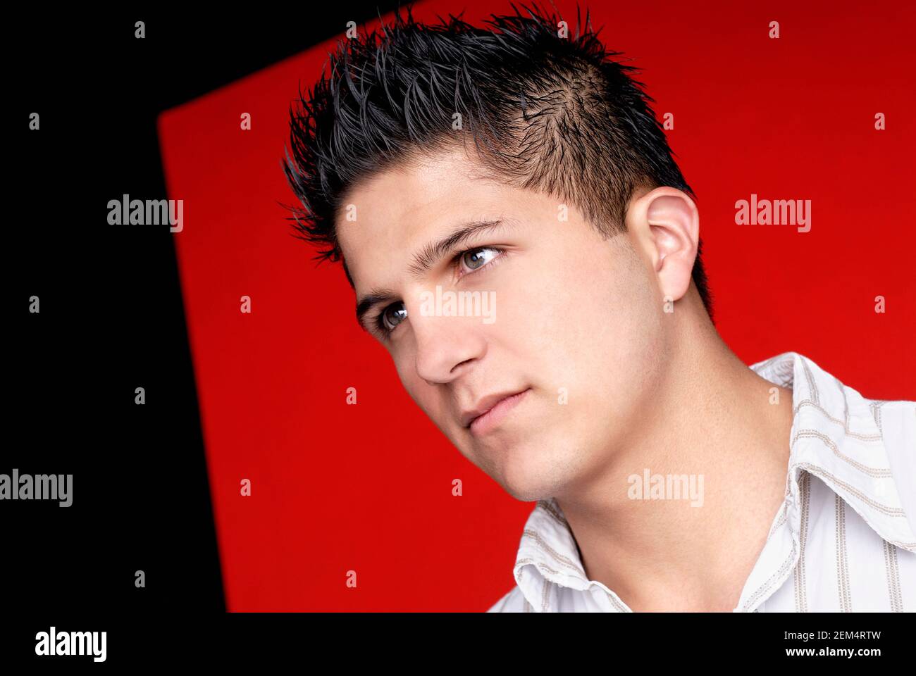 Close-up of a young man looking away Stock Photo