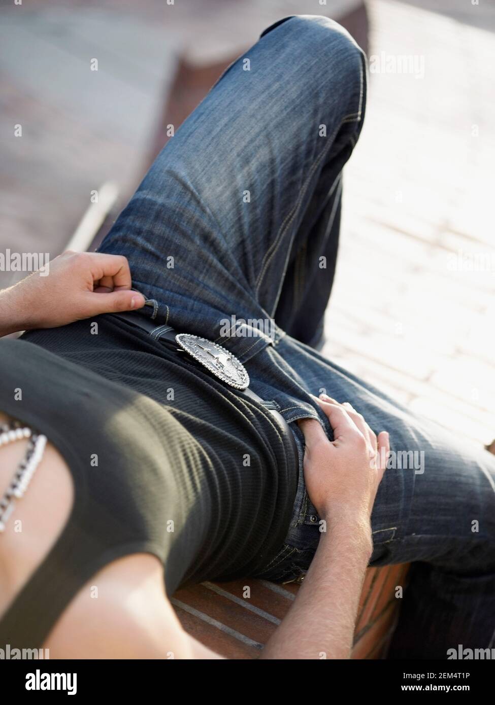 Close-up of a man lying on a ledge Stock Photo