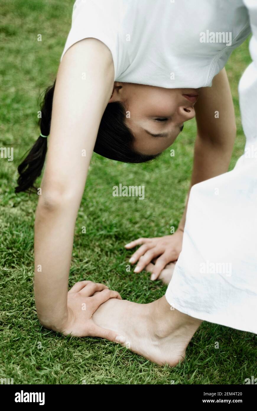 Close-up of a young woman doing yoga Stock Photo