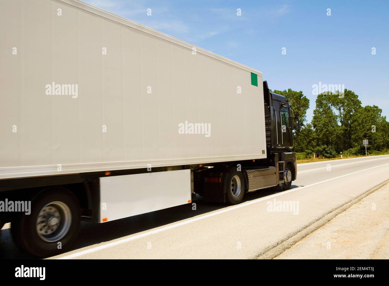 Semi-truck moving on the road Stock Photo
