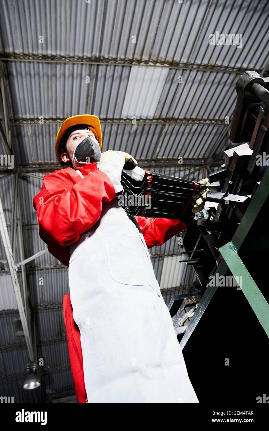 Low angle view of a mid adult man in a factory Stock Photo