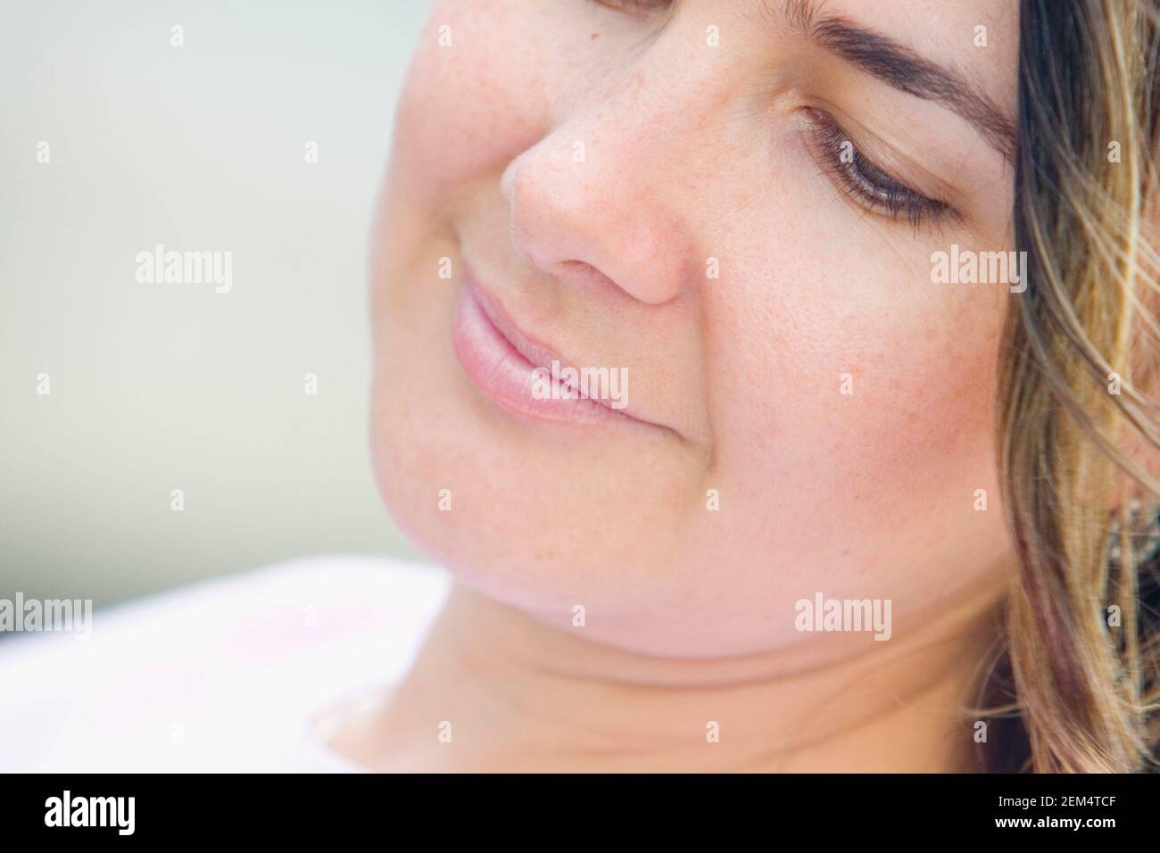 Close-up of a mid adult woman smiling Stock Photo