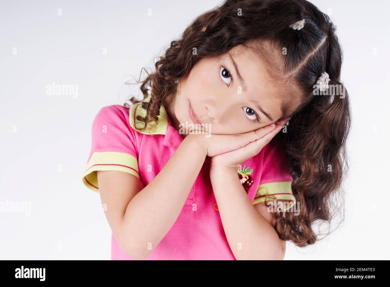 Girl with folded hands hi-res stock photography and images - Alamy