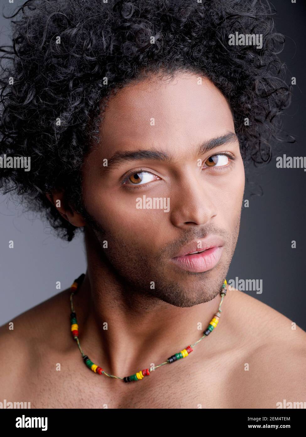 Close-up of a young man looking sideways Stock Photo