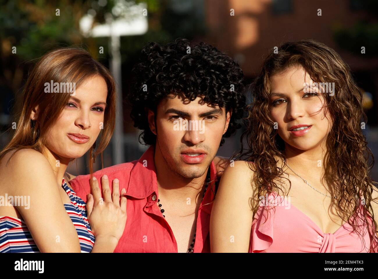 Portrait of two young women with a young man Stock Photo - Alamy