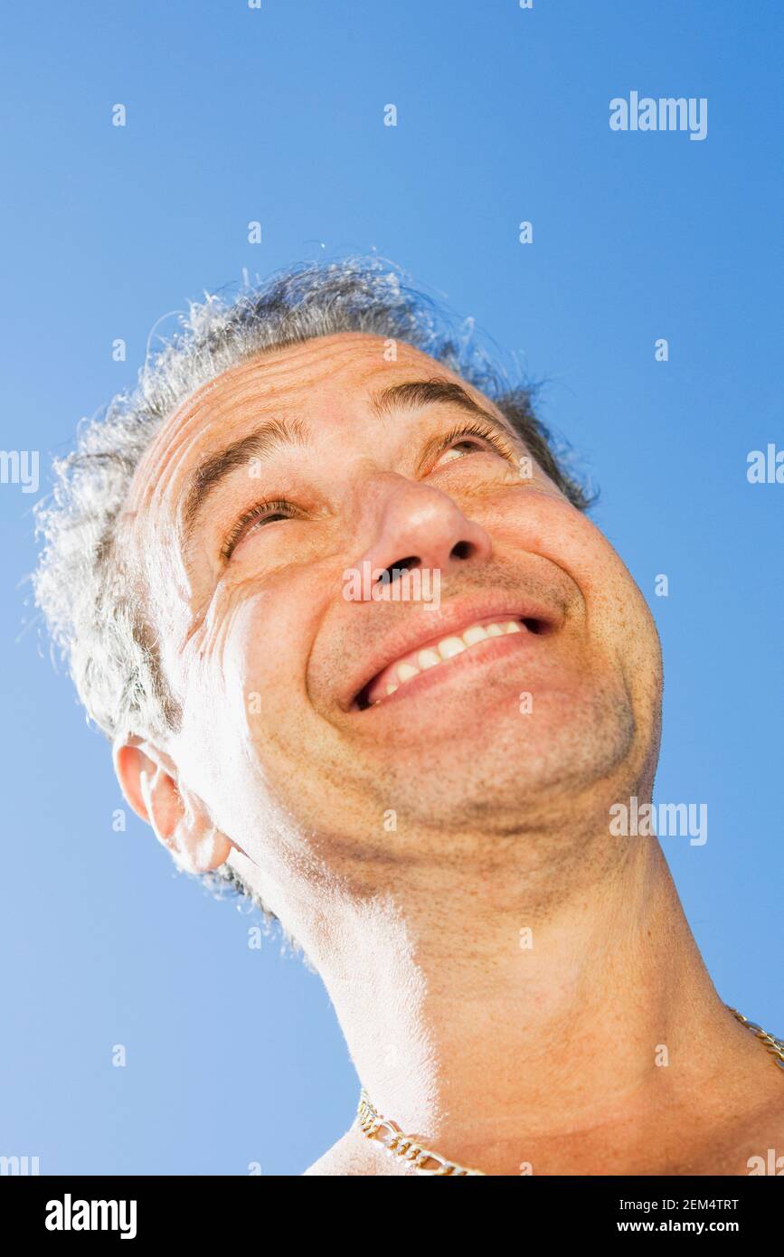 Low angle view of a mature man smiling Stock Photo