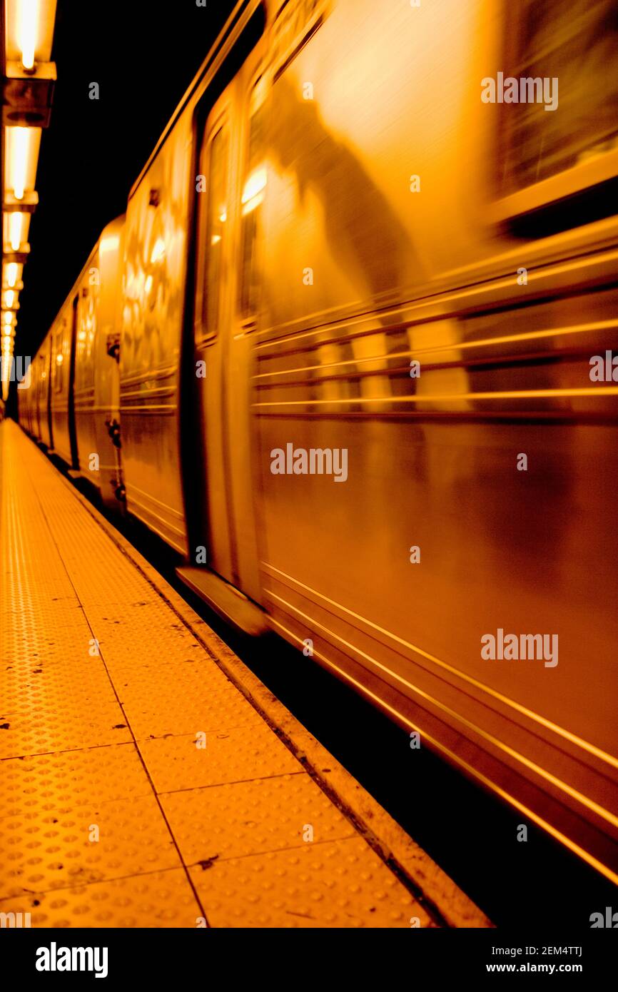 Subway train moving through a subway station Stock Photo Alamy