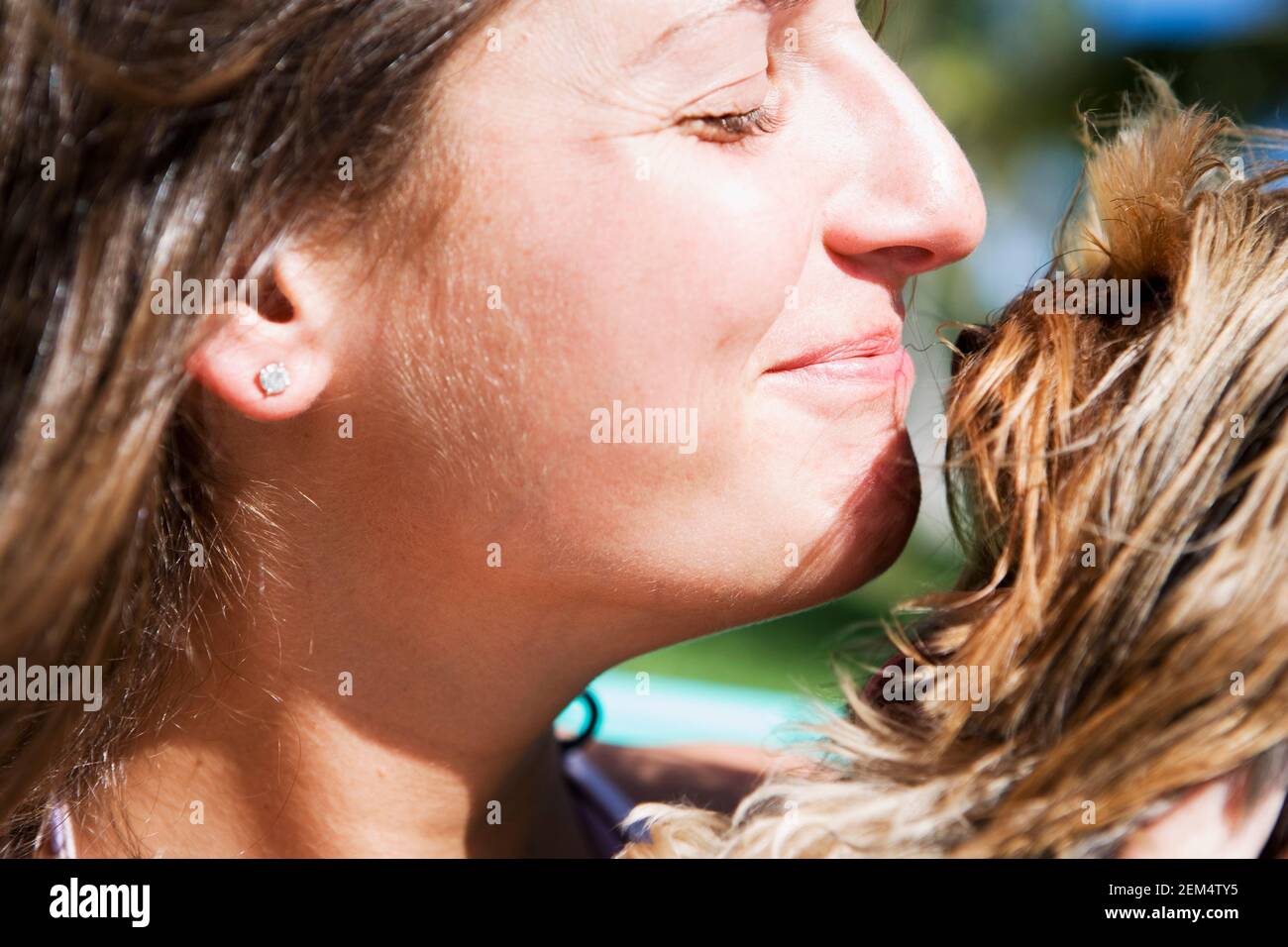 Close-up of a young woman and her dog Stock Photo