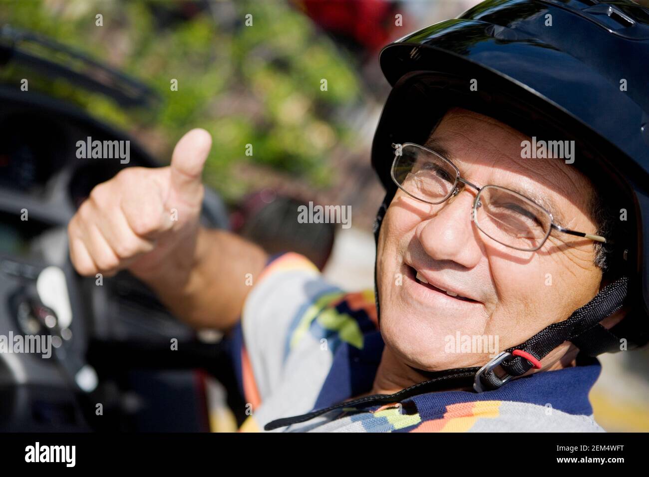 Man wearing crash helmet hi-res stock photography and images - Alamy