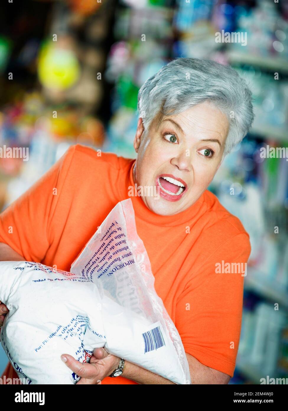 Close-up of a senior woman holding a packet of flour Stock Photo