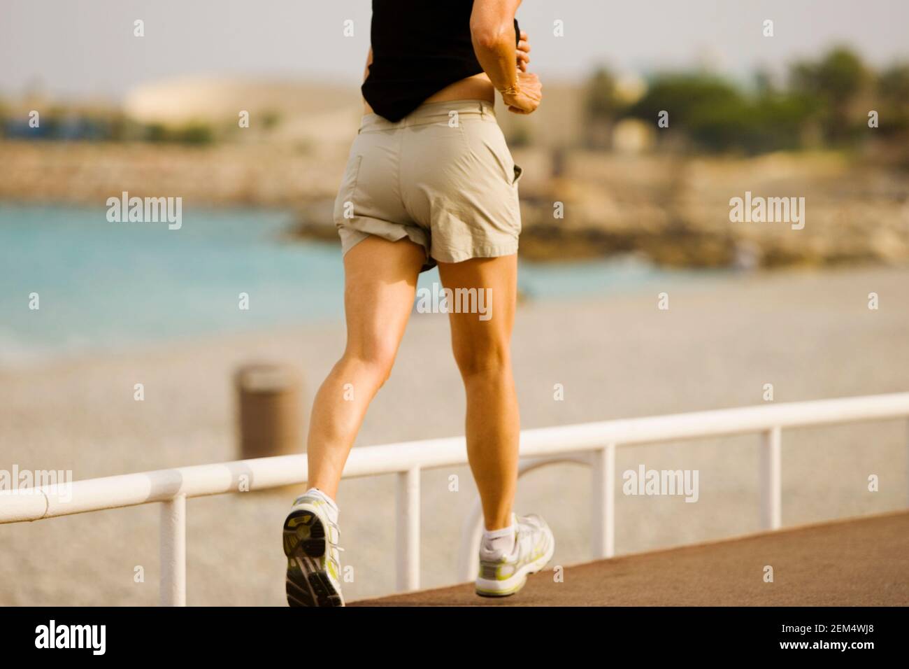 Low section view of a woman jogging Stock Photo Alamy