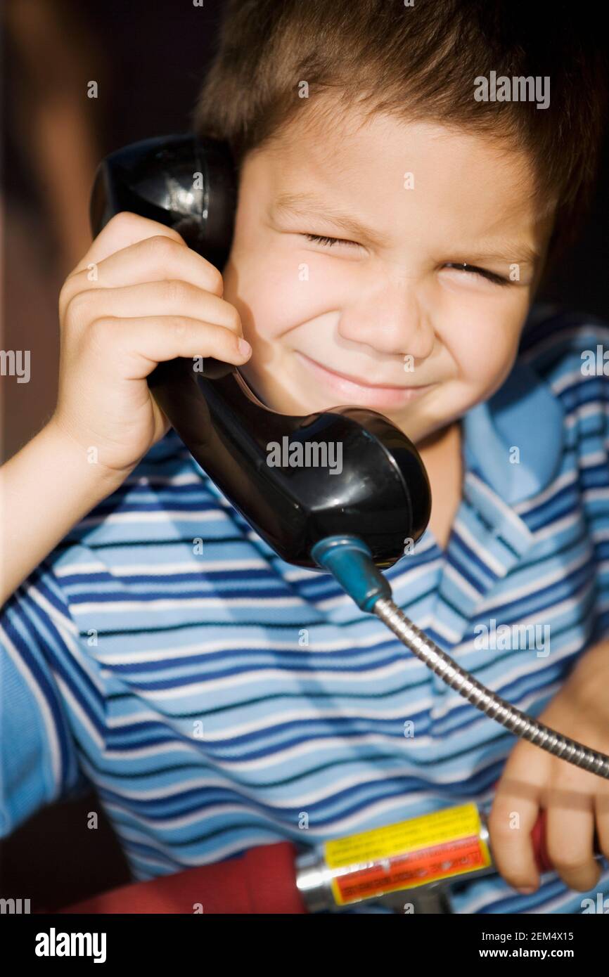 Portrait of a boy talking on the telephone Stock Photo