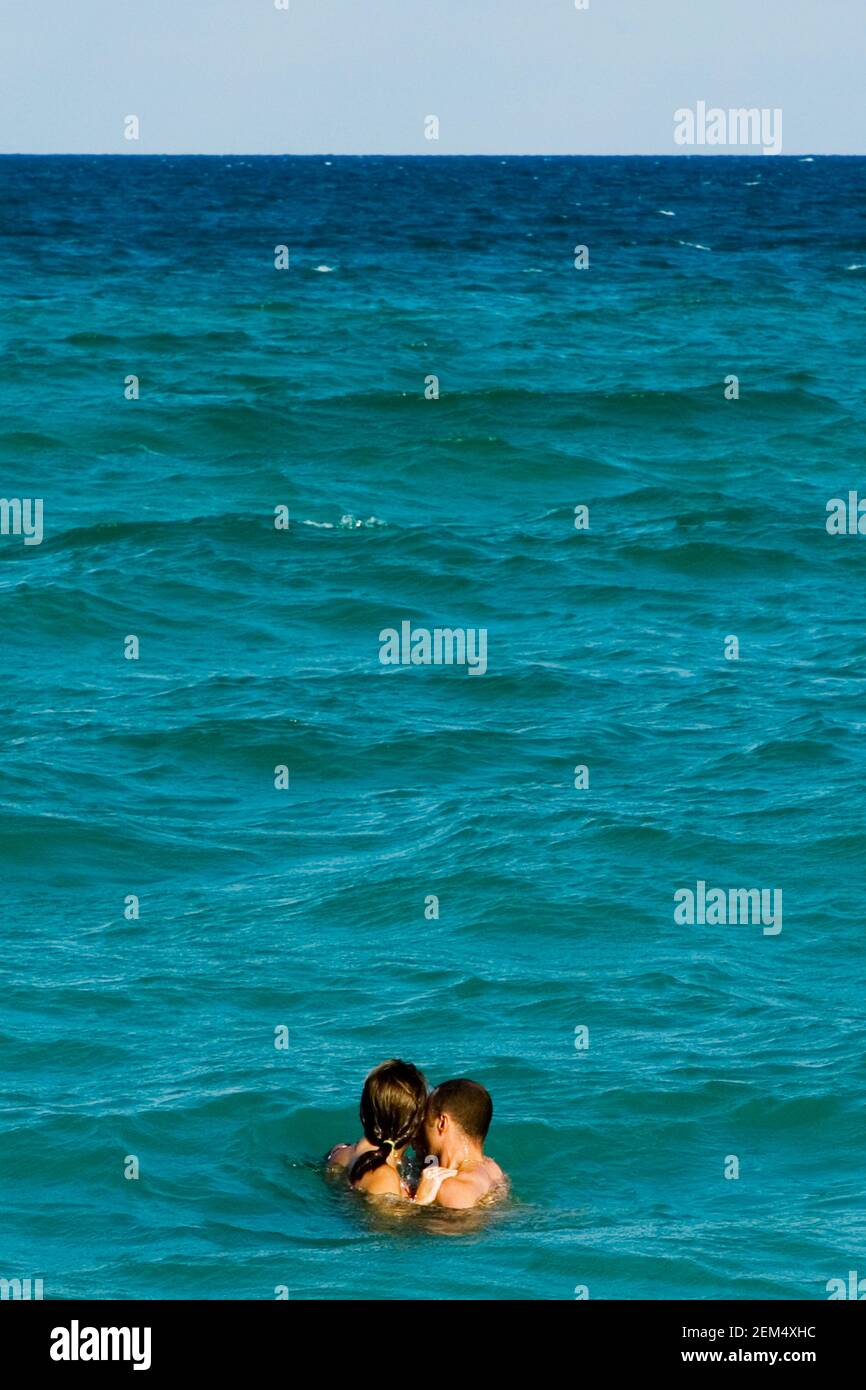 Side profile of a man and a woman in the sea, Miami, Florida, USA Stock Photo