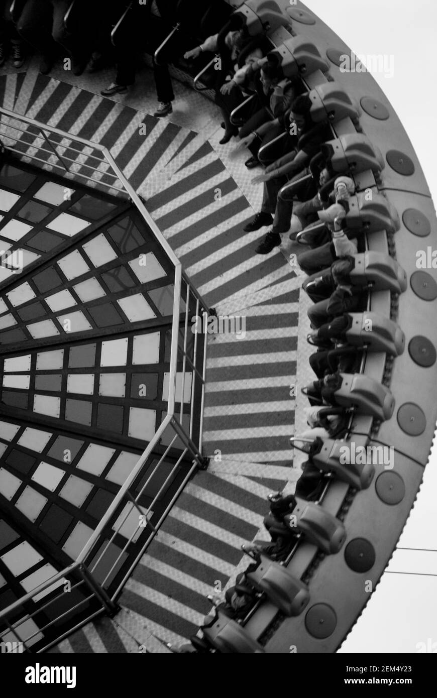 High angle view of a group of people sitting on an amusement park ride ...