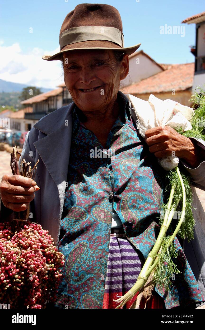 Portrait of a senior woman holding vegetables Stock Photo