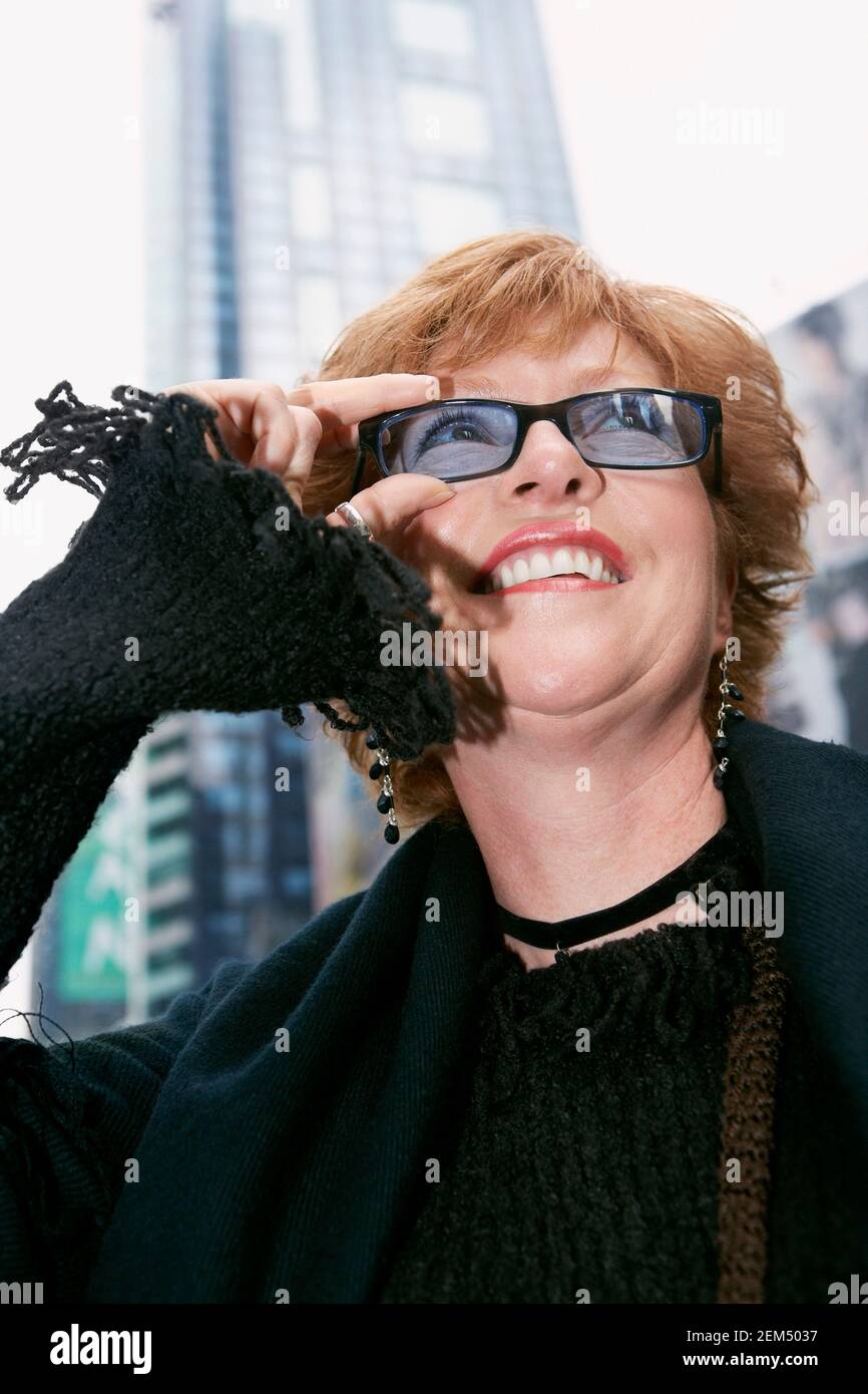 Low angle view of a mature woman looking up Stock Photo