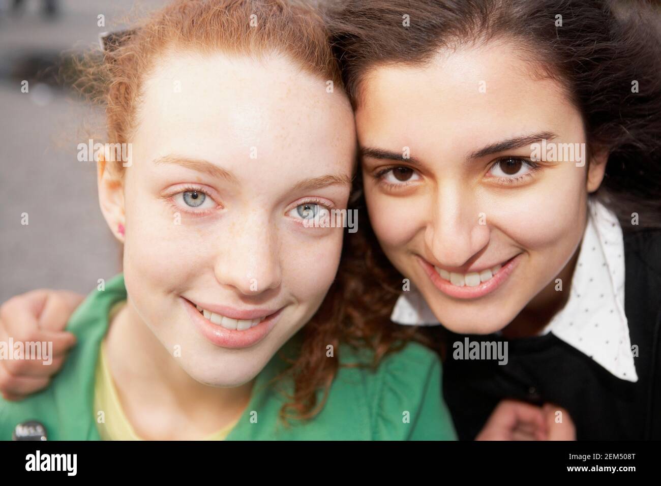 Portrait of two teenage girls smiling Stock Photo - Alamy