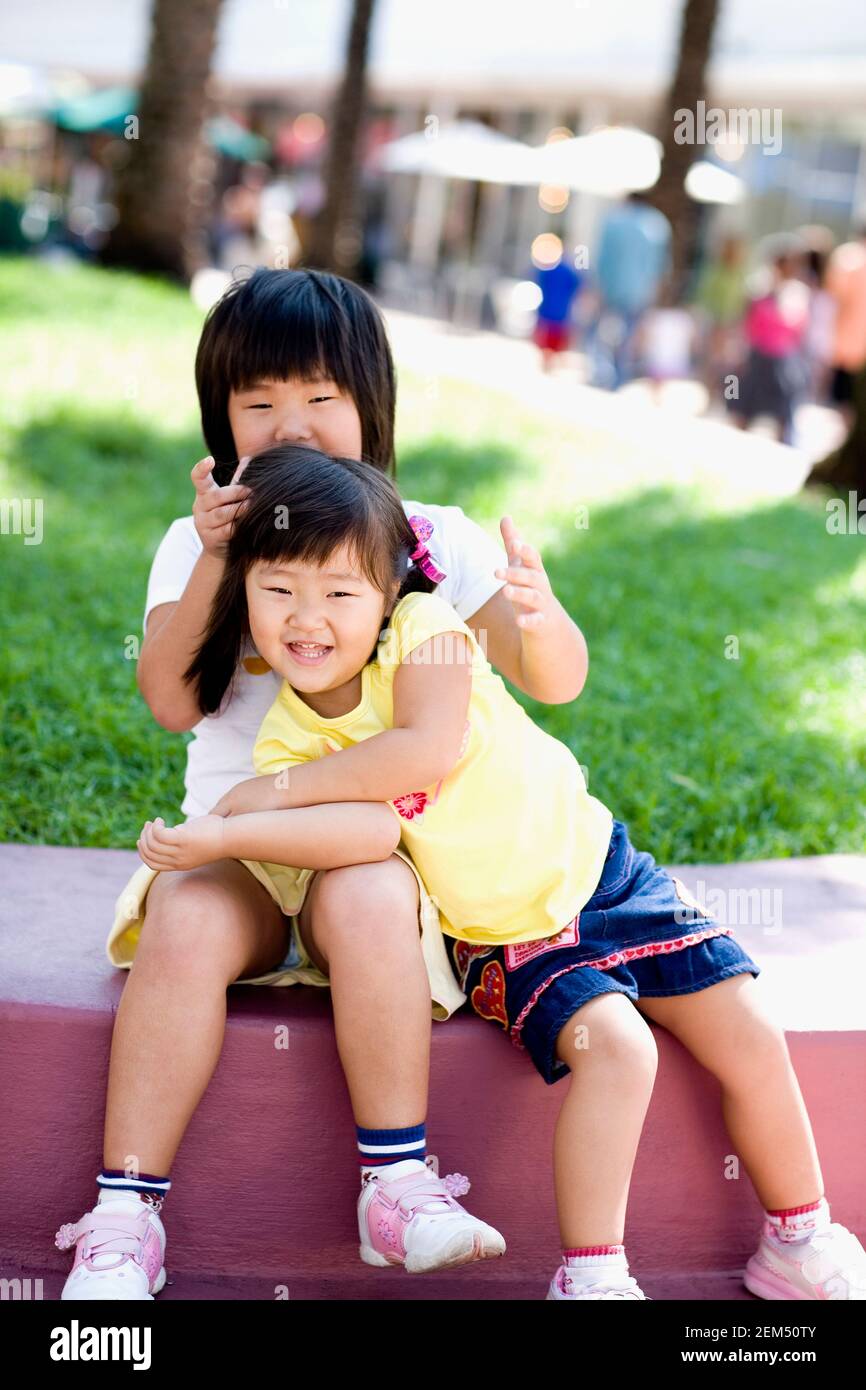Portrait of two girls smiling Stock Photo - Alamy