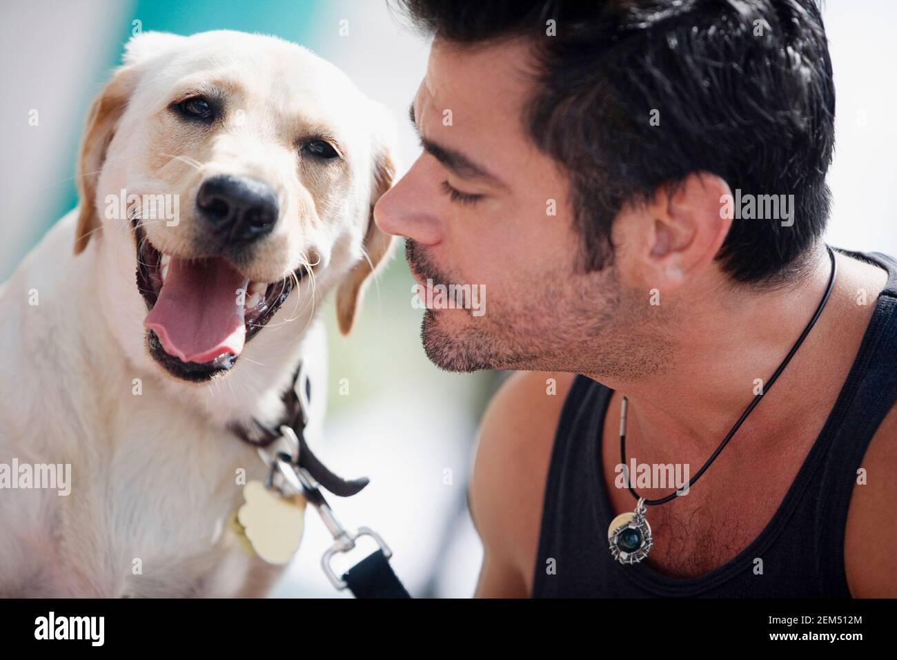 Close-up of a mid adult man and his dog Stock Photo