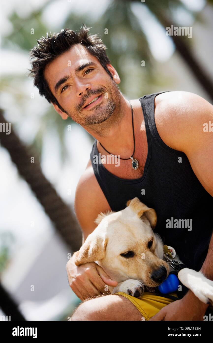 Portrait of a mid adult man with his dog Stock Photo