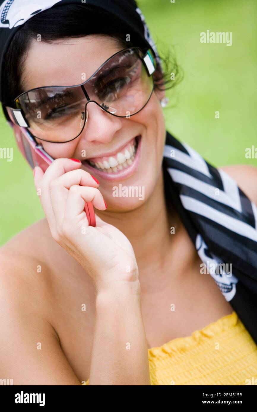 Close-up of a mid adult woman talking on a mobile phone Stock Photo