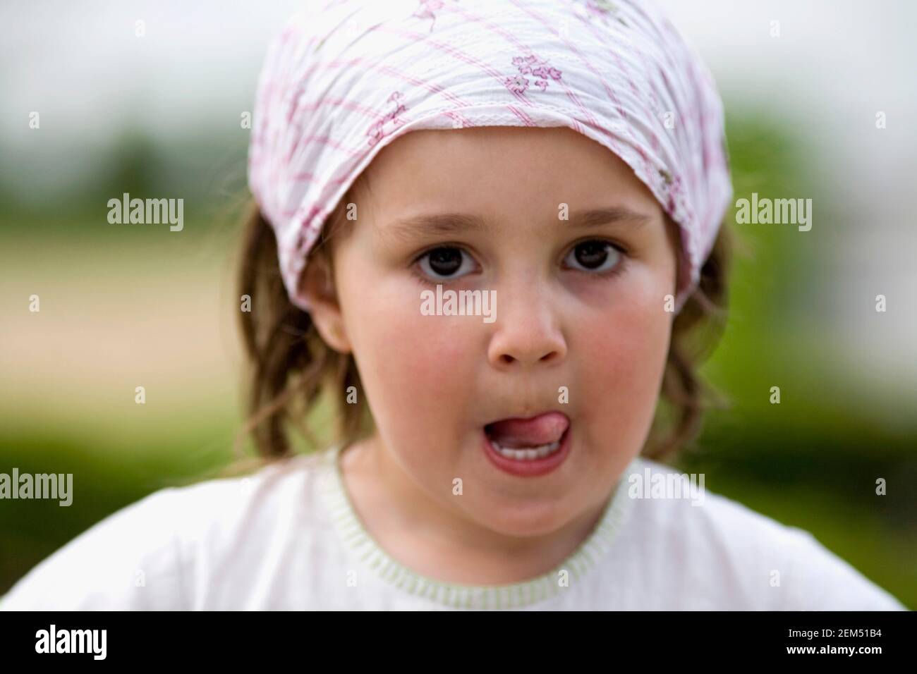 Portrait of a girl licking her lips Stock Photo