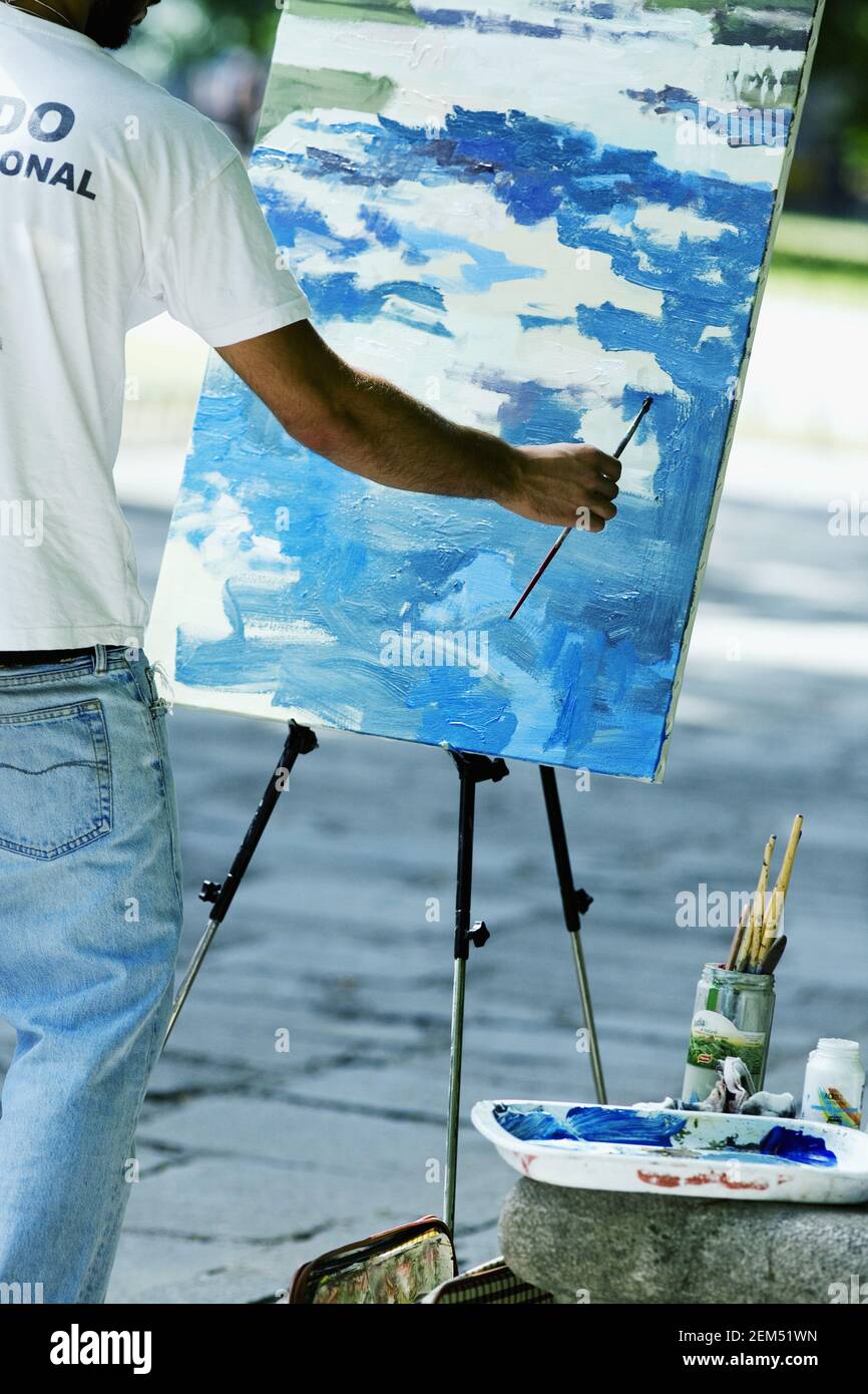 Rear view of a man painting hi-res stock photography and images - Alamy