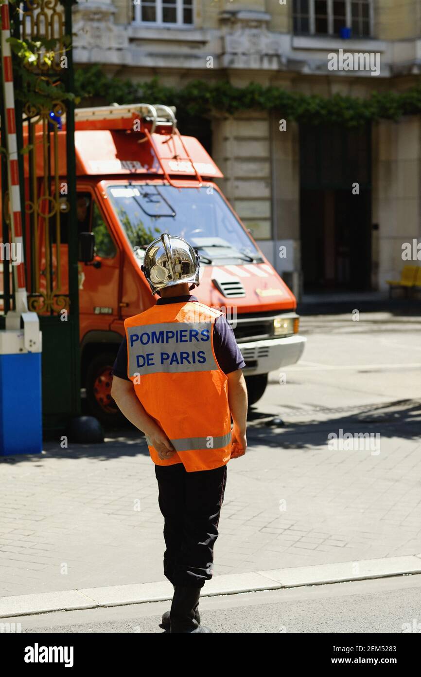 Rear view of a fireman walking, Paris, France Stock Photo