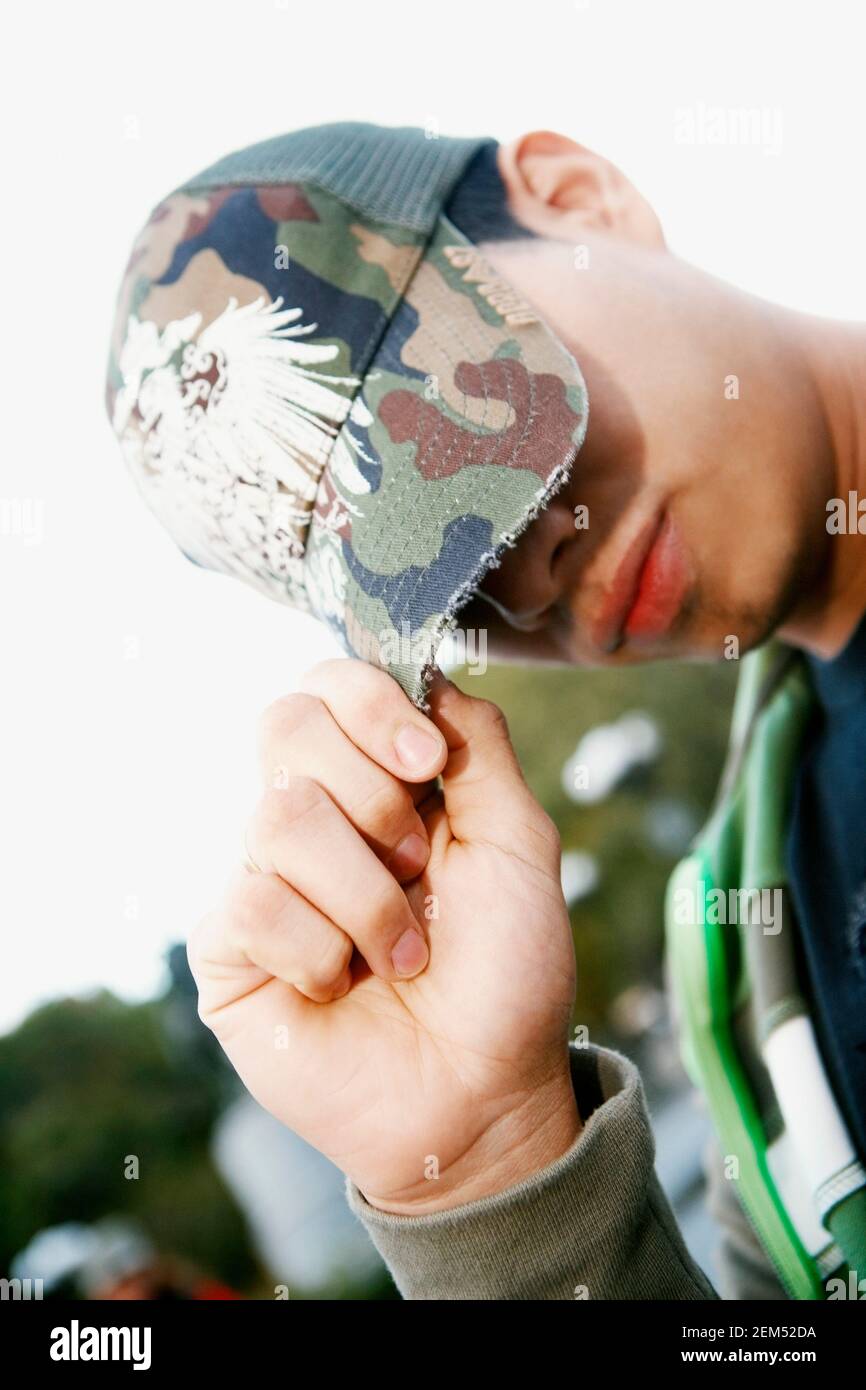 Young man with a cap hi-res stock photography and images - Alamy
