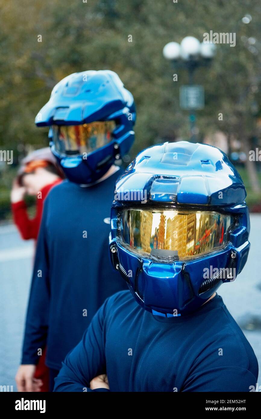 Closeup of two people wearing crash helmets Stock Photo Alamy