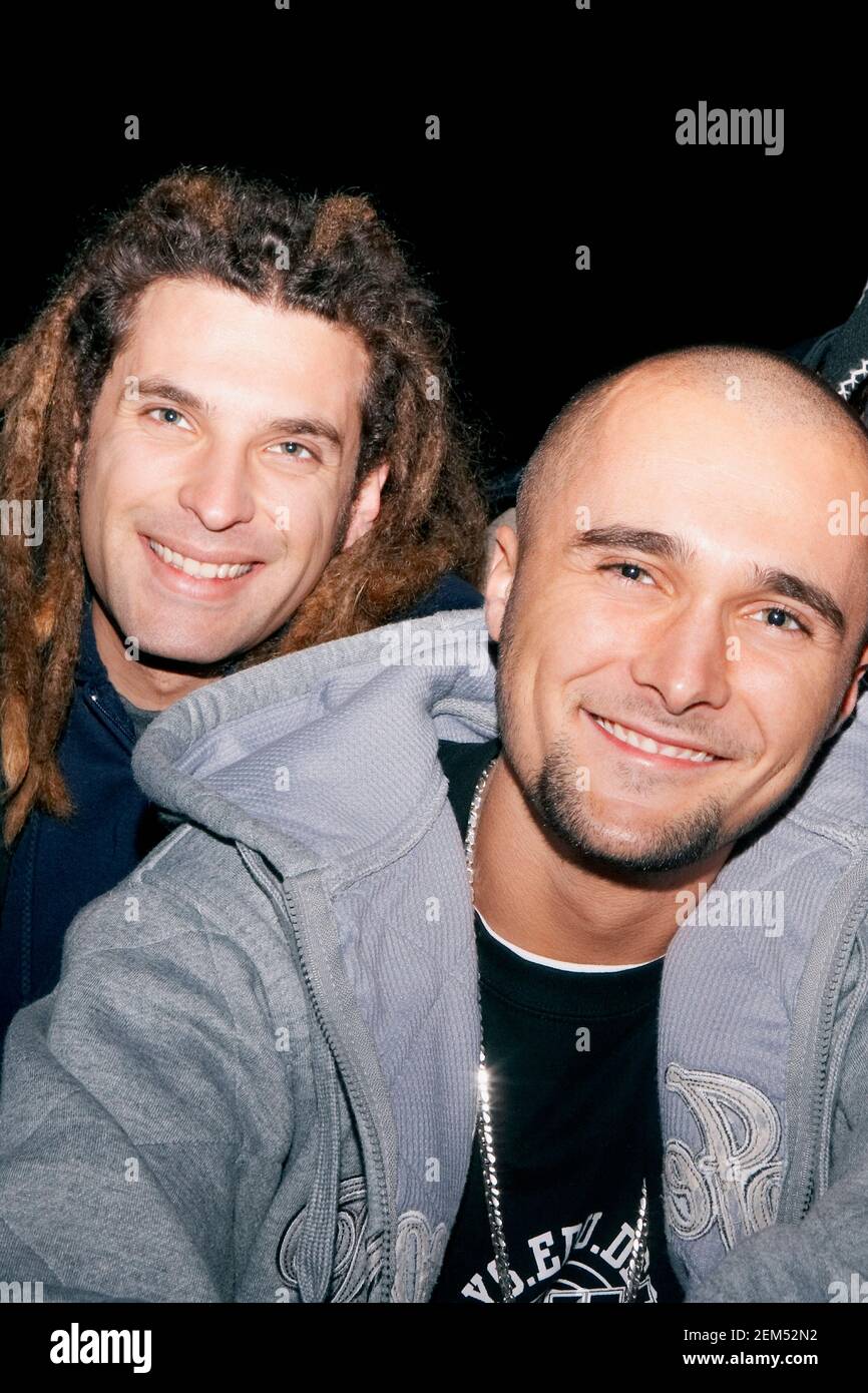 Portrait of two young men smiling Stock Photo - Alamy