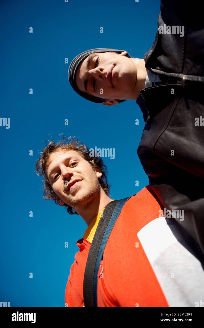Portrait of two young men smiling Stock Photo - Alamy