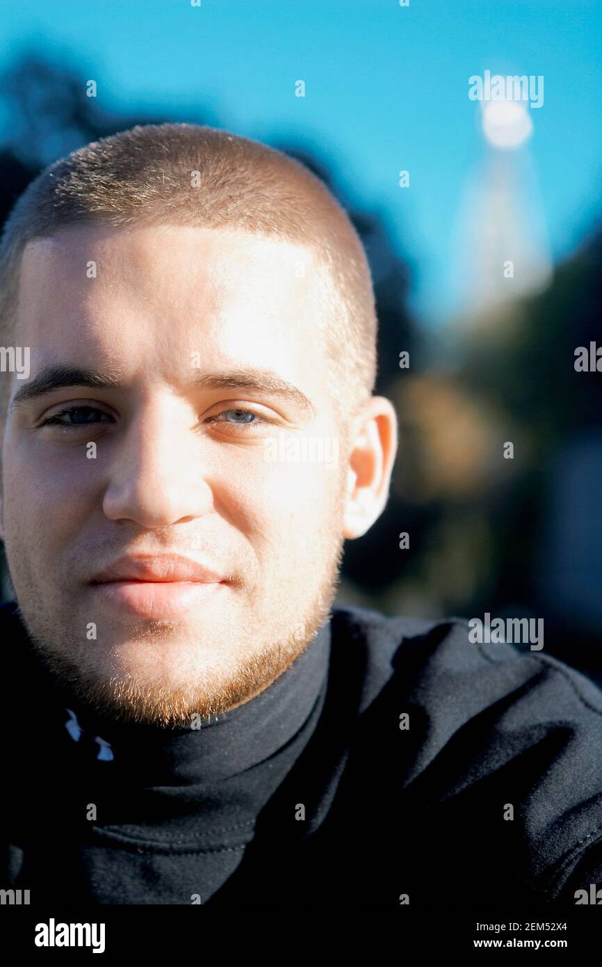 Portrait of a young man smiling Stock Photo - Alamy