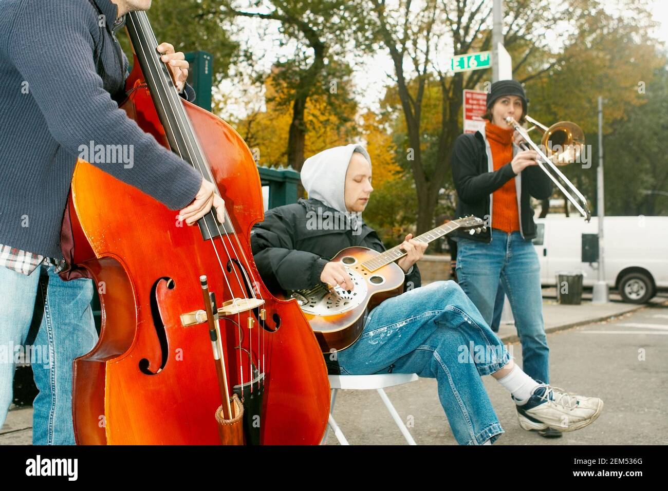 Three street musicians performing Stock Photo Alamy