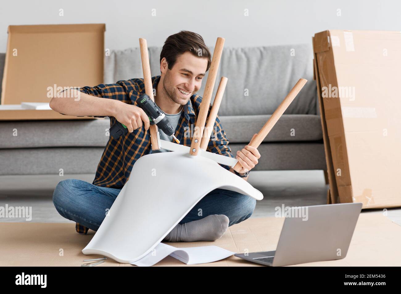 Homework, online ordering and furniture assembly in living room