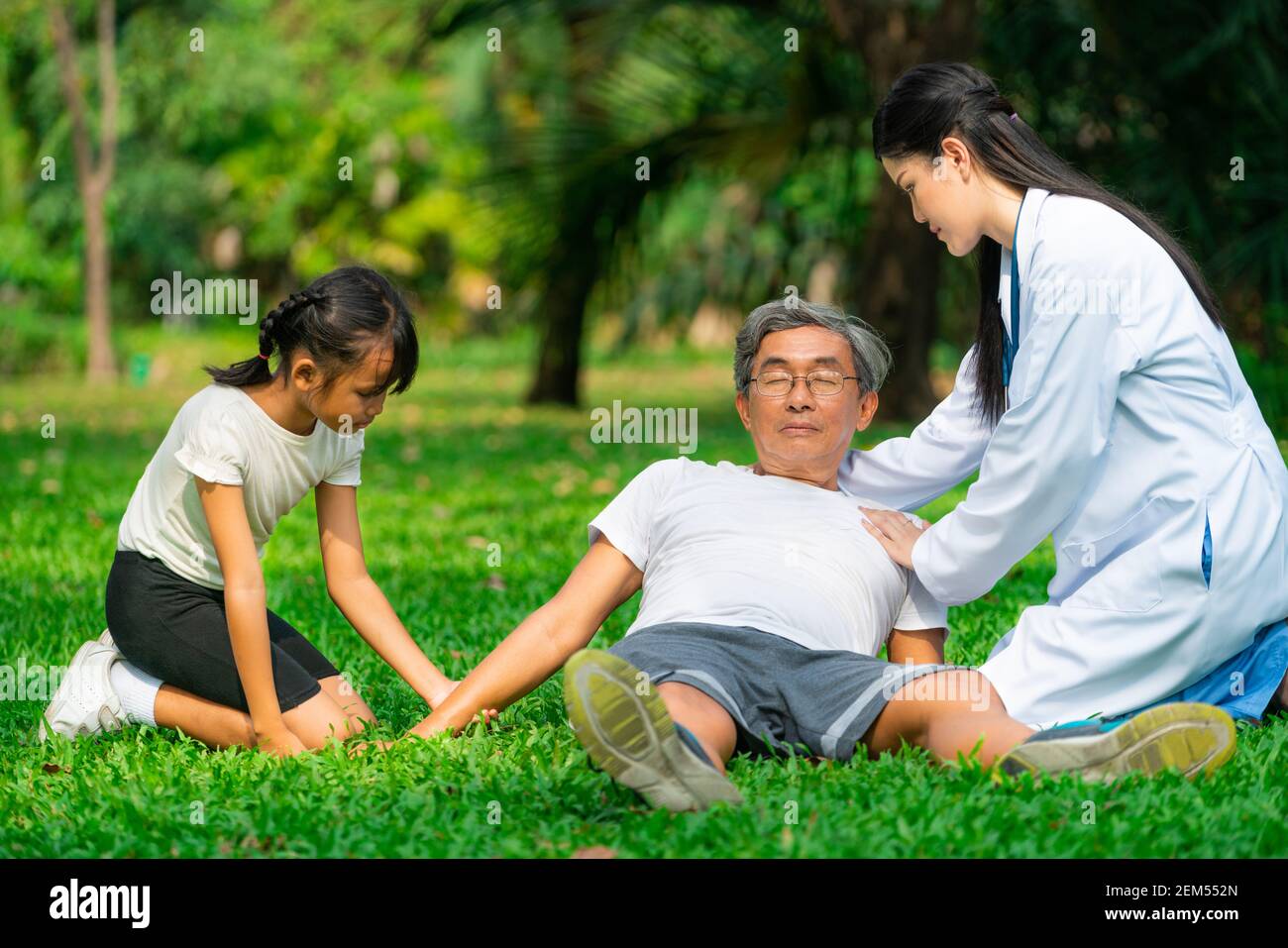 Senior man having chest pain or heart attack in the park. Old people elderly healthcare concept. Stock Photo