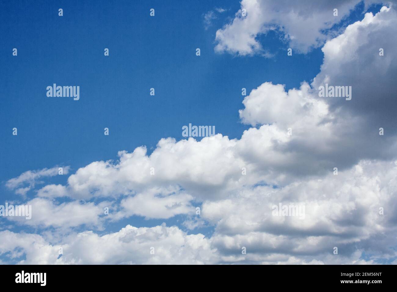 Large cumulus clouds in a blue sky Stock Photo